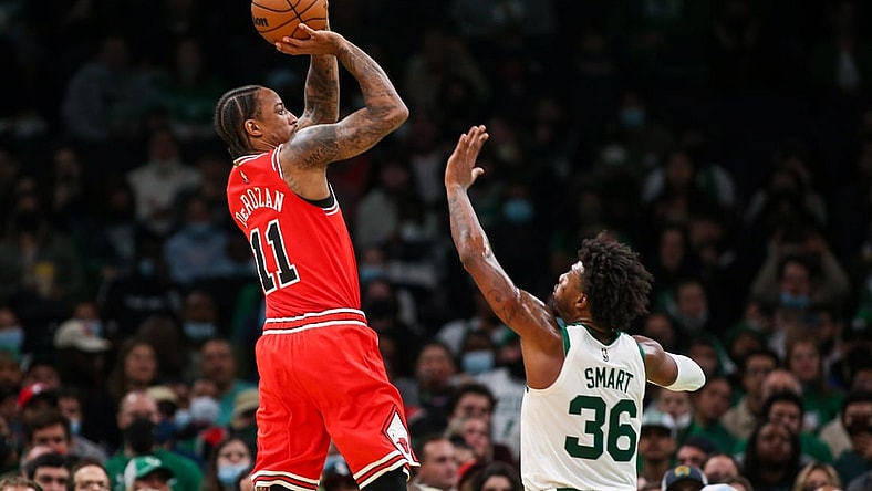 Nov 1, 2021; Boston, Massachusetts, USA; Chicago Bulls forward DeMar DeRozan (11) shoots over Boston Celtics guard Marcus Smart (36) at TD Garden. Mandatory Credit: Paul Rutherford-USA TODAY Sports