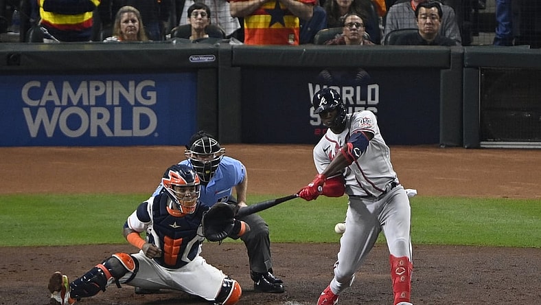 Nov 2, 2021; Houston, Texas, USA; Atlanta Braves designated hitter Jorge Soler (12) hits a three-run home run against the Houston Astros during the third inning of game six of the 2021 World Series at Minute Maid Park. Mandatory Credit: Jerome Miron-USA TODAY Sports