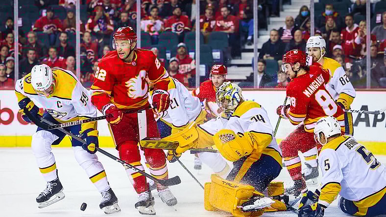 Nov 2, 2021; Calgary, Alberta, CAN; Nashville Predators goaltender Juuse Saros (74) makes a save against the Calgary Flames during the first period at Scotiabank Saddledome. Mandatory Credit: Sergei Belski-USA TODAY Sports
