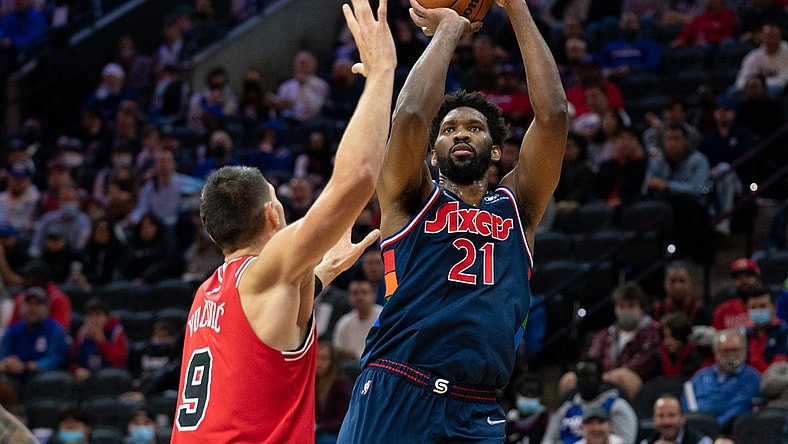 Nov 3, 2021; Philadelphia, Pennsylvania, USA; Philadelphia 76ers center Joel Embiid (21) shoots past Chicago Bulls center Nikola Vucevic (9) during the first quarter at Wells Fargo Center. Mandatory Credit: Bill Streicher-USA TODAY Sports