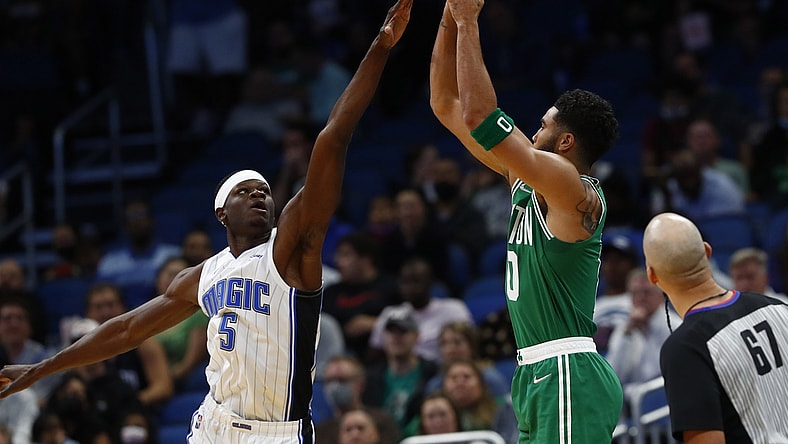Nov 3, 2021; Orlando, Florida, USA; Boston Celtics forward Jayson Tatum (0) makes a three point basket against the Orlando Magic during the first quarter at Amway Center. Mandatory Credit: Kim Klement-USA TODAY Sports