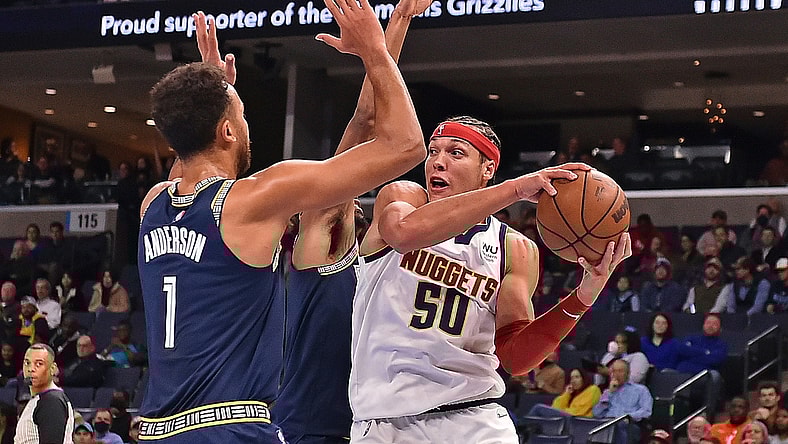 Nov 3, 2021; Memphis, Tennessee, USA; Denver Nuggets forward Aaron Gordon (50) handles the ball against Memphis Grizzlies forward Kyle Anderson (1) during the first half at FedExForum. Mandatory Credit: Justin Ford-USA TODAY Sports