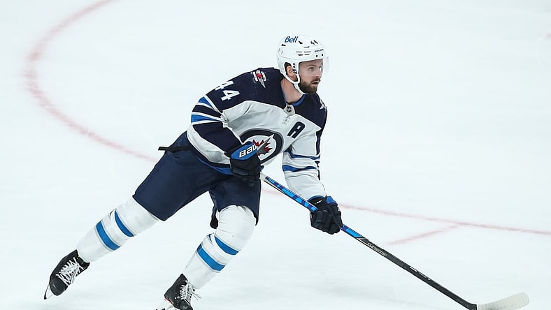Oct 19, 2021; Saint Paul, Minnesota, USA; Winnipeg Jets defenseman Josh Morrissey (44) skates with the puck against the Minnesota Wild in the third period at Xcel Energy Center. Mandatory Credit: David Berding-USA TODAY Sports