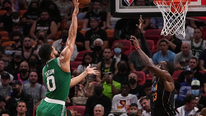 Nov 4, 2021; Miami, Florida, USA; Boston Celtics forward Jayson Tatum (0) shoots the ball against Miami Heat center Bam Adebayo (13) during the first half at FTX Arena. Mandatory Credit: Jasen Vinlove-USA TODAY Sports