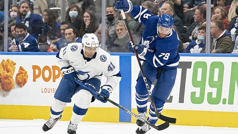 Nov 4, 2021; Toronto, Ontario, CAN; Toronto Maple Leafs defenseman T.J. Brodie (78) and Tampa Bay Lightning center Pierre-Edouard Bellemare (41) battle for the puck during the second period  at Scotiabank Arena. Mandatory Credit: Nick Turchiaro-USA TODAY Sports
