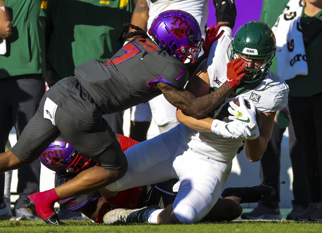 Nov 6, 2021; Fort Worth, Texas, USA;  TCU Horned Frogs safety T.J. Carter (7) tackles Baylor Bears tight end Ben Sims (86) during the first half at Amon G. Carter Stadium. Mandatory Credit: Kevin Jairaj-USA TODAY Sports