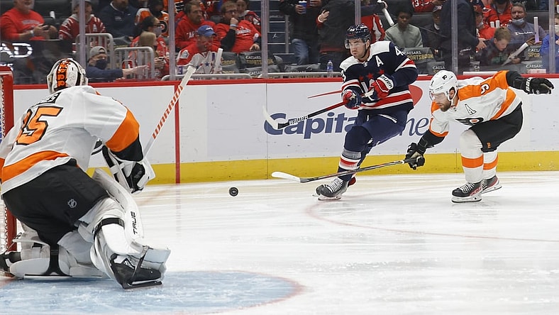 Nov 6, 2021; Washington, District of Columbia, USA; Washington Capitals right wing Tom Wilson (43) shoots the puck on Philadelphia Flyers goaltender Martin Jones (35) as Flyers defenseman Ivan Provorov (9) chases during the first period at Capital One Arena. Mandatory Credit: Geoff Burke-USA TODAY Sportsa