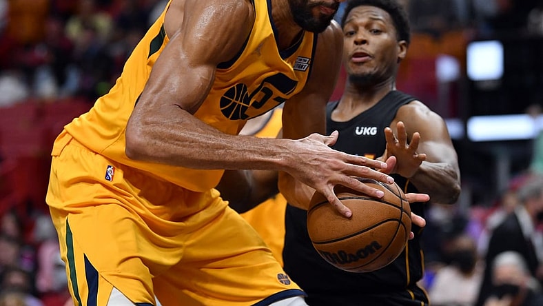 Nov 6, 2021; Miami, Florida, USA; Utah Jazz center Rudy Gobert (27) tries to keep possession of the ball against Miami Heat guard Kyle Lowry (7) during the first half at FTX Arena. Mandatory Credit: Jim Rassol-USA TODAY Sports