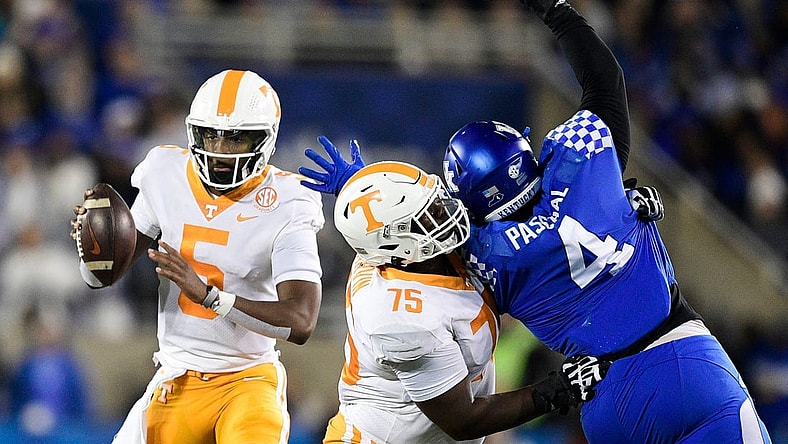 Tennessee quarterback Hendon Hooker (5) looks to pass as Tennessee offensive lineman Jerome Carvin (75) defends against Kentucky defensive end Josh Paschal (4) during an SEC football game between Tennessee and Kentucky at Kroger Field in Lexington, Ky. on Saturday, Nov. 6, 2021.

Kns Tennessee Kentucky Football