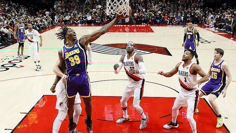 Nov 6, 2021; Portland, Oregon, USA; Los Angeles Lakers center Dwight Howard (39) grabs a rebound as Portland Trail Blazers center Jusuf Nurkic (27, left) defends during the first half at Moda Center. Mandatory Credit: Soobum Im-USA TODAY Sports