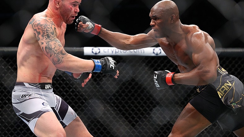 Nov 6, 2021; New York, NY, USA; Kamaru Usman (red gloves) competes against Colby Covington (blue gloves) during UFC 268 at Madison Square Garden. Mandatory Credit: Ed Mulholland-USA TODAY Sports