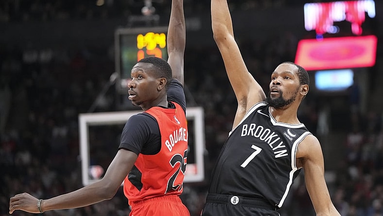Nov 7, 2021; Toronto, Ontario, CAN; Brooklyn Nets forward Kevin Durant (7) tracks his shot against Toronto Raptors forward Chris Boucher (25) during the first half at Scotiabank Arena. Mandatory Credit: Kevin Sousa-USA TODAY Sports