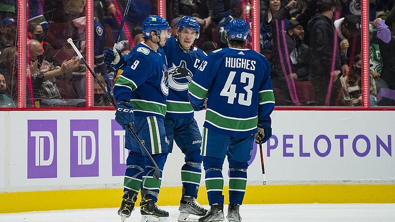 Nov 7, 2021; Vancouver, British Columbia, CAN; Vancouver Canucks forward J.T. Miller (9) and forward Bo Horvat (53) and defenseman Quinn Hughes (43) celebrate Miller   s goal against the Dallas Stars in the second period at Rogers Arena. Mandatory Credit: Bob Frid-USA TODAY Sports