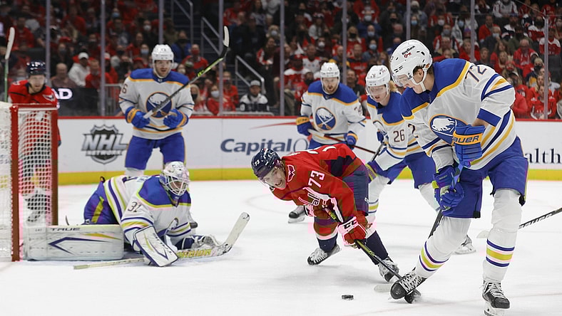 Nov 8, 2021; Washington, District of Columbia, USA; Washington Capitals left wing Conor Sheary (73) and Buffalo Sabres right wing Tage Thompson (72) battle for the puck in front of Sabres goaltender Dustin Tokarski (31) during the first period at Capital One Arena. Mandatory Credit: Geoff Burke-USA TODAY Sports