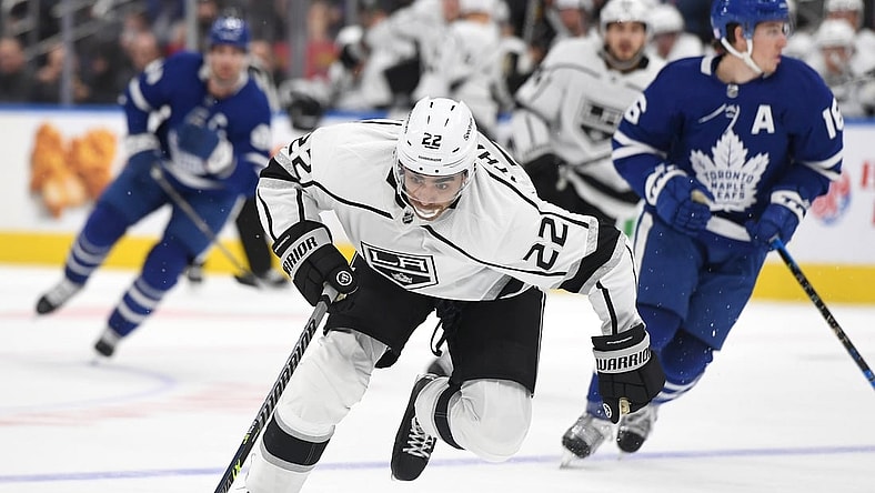 Nov 8, 2021; Toronto, Ontario, CAN;    Los Angeles Kings forward Andreas Athanasiou (22) rushes the puck up ice en route to scoring a goal against Toronto Maple Leafs in the first period at Scotiabank Arena. Mandatory Credit: Dan Hamilton-USA TODAY Sports