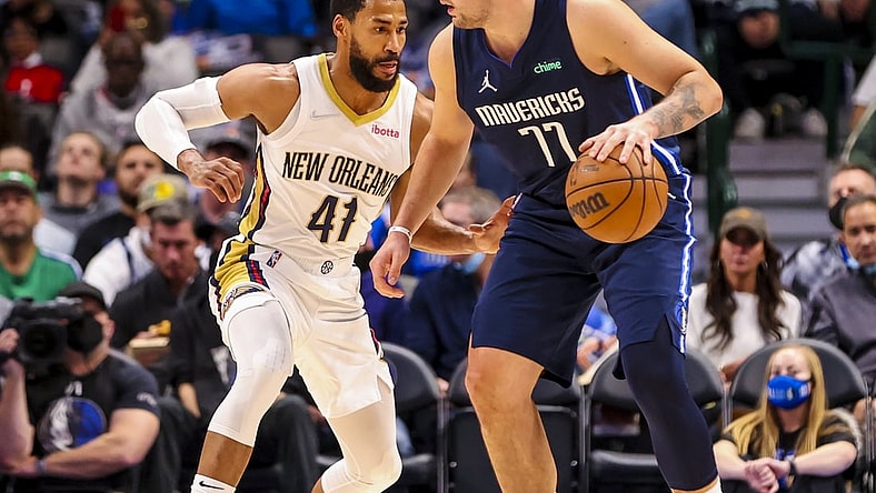 Nov 8, 2021; Dallas, Texas, USA; Dallas Mavericks guard Luka Doncic (77) controls the ball as New Orleans Pelicans forward Garrett Temple (41) defends during the first quarter at American Airlines Center. Mandatory Credit: Kevin Jairaj-USA TODAY Sports
