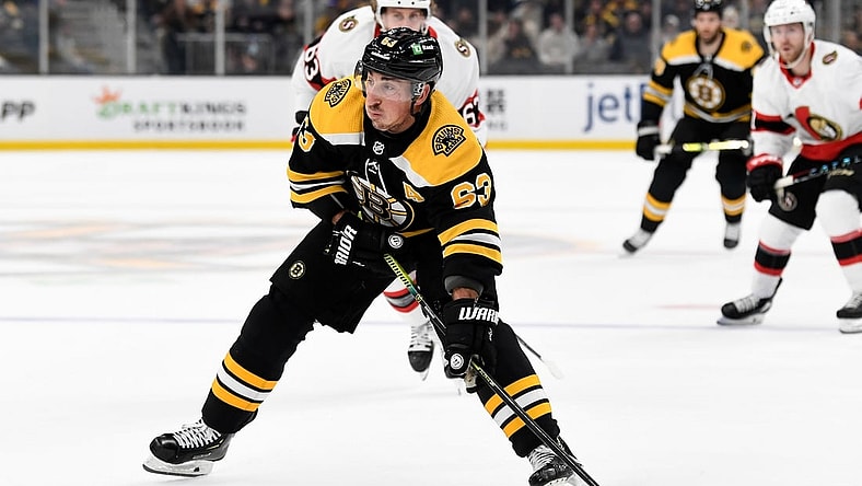 Nov 9, 2021; Boston, Massachusetts, USA; Boston Bruins center Brad Marchand (63) skates with the puck against the Ottawa Senators during the first period at the TD Garden. Mandatory Credit: Brian Fluharty-USA TODAY Sports