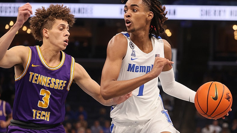 Memphis Tigers guard Emoni Bates drives past Tennessee Tech Golden Eagles guard Keishawn Davidson during their game at FedExForum on Tuesday, Nov. 9, 2021.

Jrca9418
