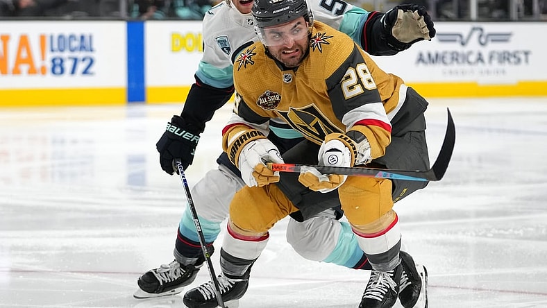 Nov 9, 2021; Las Vegas, Nevada, USA; Seattle Kraken defenseman Jeremy Lauzon (55) keeps pace with Vegas Golden Knights left wing William Carrier (28) during the second period at T-Mobile Arena. Mandatory Credit: Stephen R. Sylvanie-USA TODAY Sports