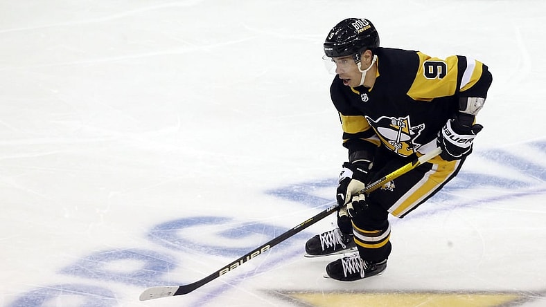 Nov 4, 2021; Pittsburgh, Pennsylvania, USA;  Pittsburgh Penguins center Evan Rodrigues (9) skates with the puck against the Philadelphia Flyers during the second period at PPG Paints Arena. Mandatory Credit: Charles LeClaire-USA TODAY Sports
