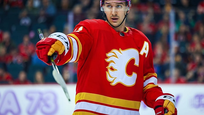 Nov 4, 2021; Calgary, Alberta, CAN; Calgary Flames center Mikael Backlund (11) against the Dallas Stars during the third period at Scotiabank Saddledome. Mandatory Credit: Sergei Belski-USA TODAY Sports