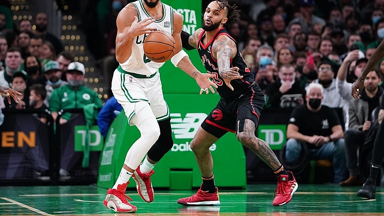 Nov 10, 2021; Boston, Massachusetts, USA; Toronto Raptors guard Gary Trent Jr. (33) defends against Boston Celtics forward Jayson Tatum (0) in the second quarter at TD Garden. Mandatory Credit: David Butler II-USA TODAY Sports