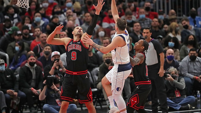 Nov 10, 2021; Chicago, Illinois, USA; Dallas Mavericks guard Luka Doncic (77) shoots over Chicago Bulls center Nikola Vucevic (9) during the first half at the United Center. Mandatory Credit: Dennis Wierzbicki-USA TODAY Sports