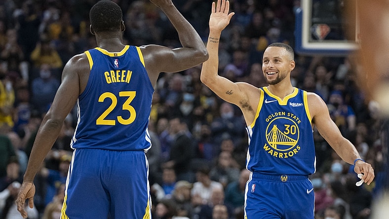 November 10, 2021; San Francisco, California, USA; Golden State Warriors forward Draymond Green (23) and guard Stephen Curry (30) celebrate against the Minnesota Timberwolves during the second quarter at Chase Center. Mandatory Credit: Kyle Terada-USA TODAY Sports