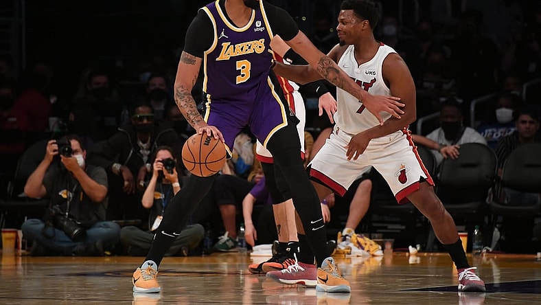 Nov 10, 2021; Los Angeles, California, USA; Los Angeles Lakers forward Anthony Davis (3) moves the ball against Miami Heat guard Kyle Lowry (7) during the first half at Staples Center. Mandatory Credit: Richard Mackson-USA TODAY Sports