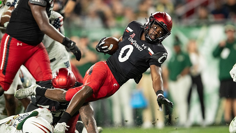 Nov 12, 2021; Tampa, Florida, USA; Cincinnati Bearcats running back Charles McClelland (0) runs with the ball in the second quarter against the South Florida Bulls at Raymond James Stadium. Mandatory Credit: Jeremy Reper-USA TODAY Sports