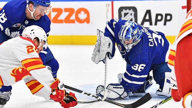 Nov 12, 2021; Toronto, Ontario, CAN; Toronto Maple Leafs goalie Jack Campbell (36) makes a save in front go Calgary Flames center Blake Coleman (20) and Toronto Maple Leafs defenceman T.J. Brodie (78) in the first period at Scotiabank Arena. Mandatory Credit: Gerry Angus-USA TODAY Sports