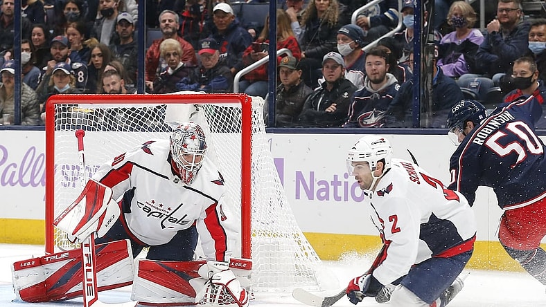 Nov 12, 2021; Columbus, Ohio, USA; Washington Capitals goalie Ilya Samsonov (30) tracks the rebound of a Columbus Blue Jackets left wing Eric Robinson (50) shot during the first period at Nationwide Arena. Mandatory Credit: Russell LaBounty-USA TODAY Sports