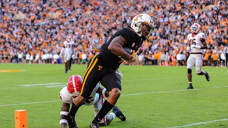 Nov 13, 2021; Knoxville, Tennessee, USA; Tennessee Volunteers wide receiver Velus Jones Jr. (1) runs past Georgia Bulldogs defensive back Latavious Brini (36) for a touchdown during the first quarter at Neyland Stadium. Mandatory Credit: Bryan Lynn-USA TODAY Sports