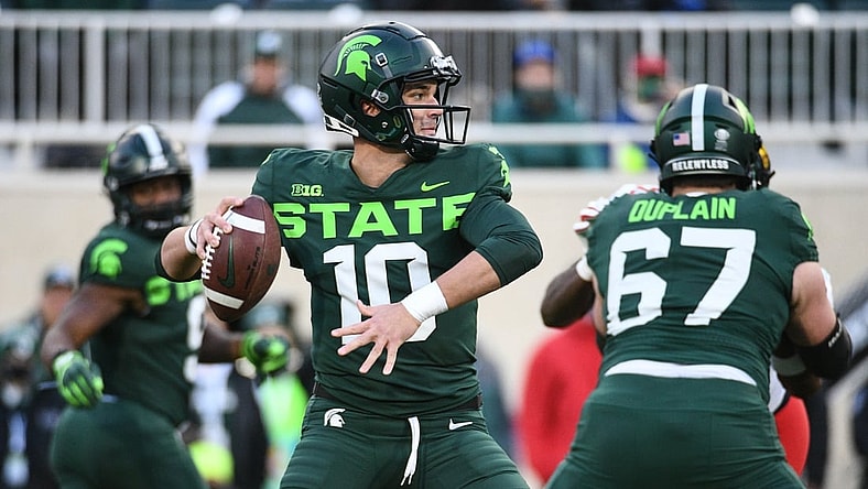 Nov 13, 2021; East Lansing, Michigan, USA; Michigan State Spartans quarterback Payton Thorne (10) drops back to throw the ball during the first quarter against the Maryland Terrapins at Spartan Stadium. Mandatory Credit: Tim Fuller-USA TODAY Sports