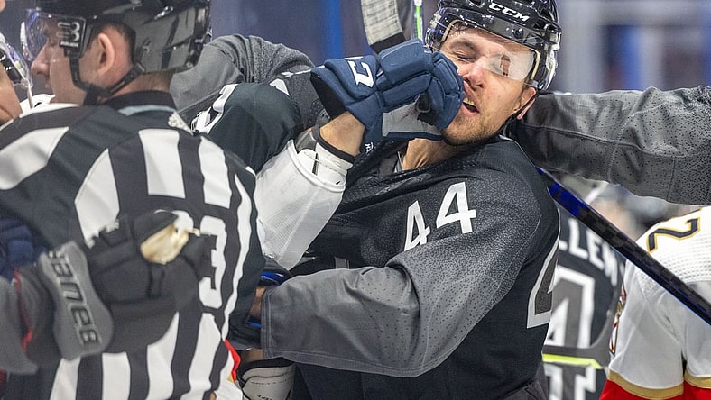 Nov 13, 2021; Tampa, Florida, USA; Tampa Bay Lightning defenseman Jan Rutta (44) is punched by Florida Panthers left wing Ryan Lomberg (94) in the first period at Amalie Arena. Mandatory Credit: Nathan Ray Seebeck-USA TODAY Sports