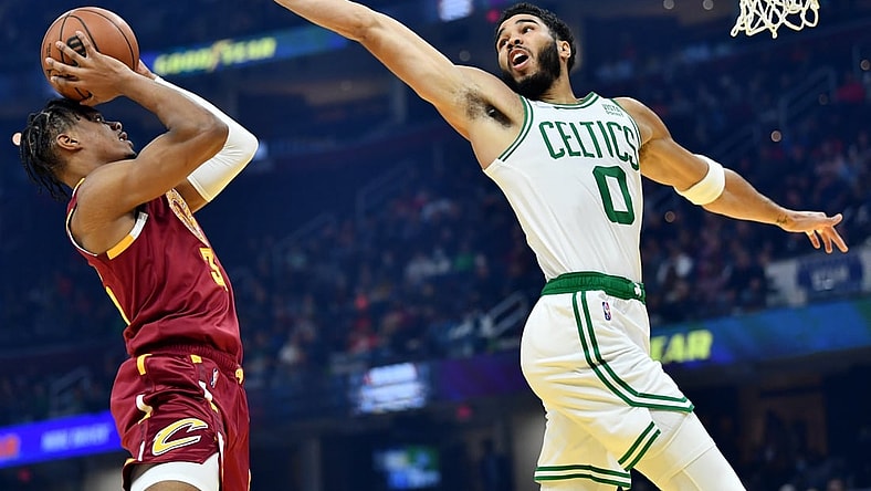 Nov 13, 2021; Cleveland, Ohio, USA; Cleveland Cavaliers forward Isaac Okoro (35) shoots against Boston Celtics forward Jayson Tatum (0) during the first quarter at Rocket Mortgage FieldHouse. Mandatory Credit: Ken Blaze-USA TODAY Sports