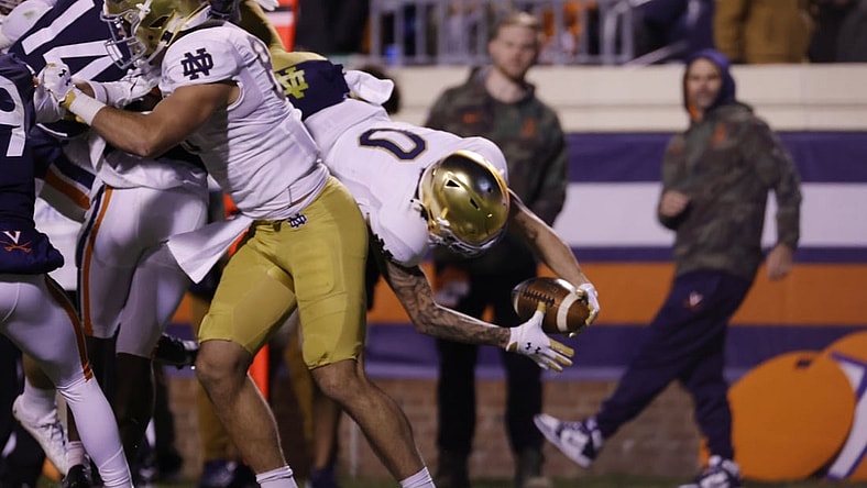 Nov 13, 2021; Charlottesville, Virginia, USA; Notre Dame Fighting Irish wide receiver Braden Lenzy (0) scorers a touchdown against the Virginia Cavaliers during the first quarter at Scott Stadium. Mandatory Credit: Geoff Burke-USA TODAY Sportsa