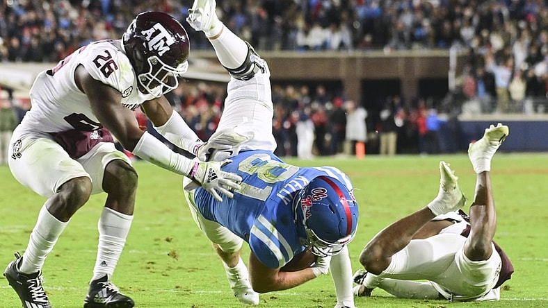 Nov 13, 2021; Oxford, Mississippi, USA; Mississippi Rebels tight end Casey Kelly (81) is stopped short of the endzone by Texas A&M Aggies defensive back Demani Richardson (26) and defensive back Tyreek Chappell (7) during the second quarter at Vaught-Hemingway Stadium. Mandatory Credit: Matt Bush-USA TODAY Sports