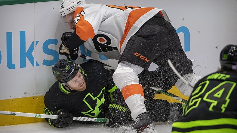 Nov 13, 2021; Dallas, Texas, USA; Philadelphia Flyers defenseman Justin Braun (61) checks Dallas Stars center Joe Pavelski (16) during the first period at the American Airlines Center. Mandatory Credit: Jerome Miron-USA TODAY Sports