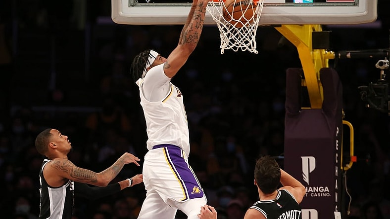 Nov 14, 2021; Los Angeles, California, USA;  Los Angeles Lakers forward Anthony Davis (3) dunks during the first half of the NBA game against San Antonio Spurs at Staples Center. Mandatory Credit: Kiyoshi Mio-USA TODAY Sports