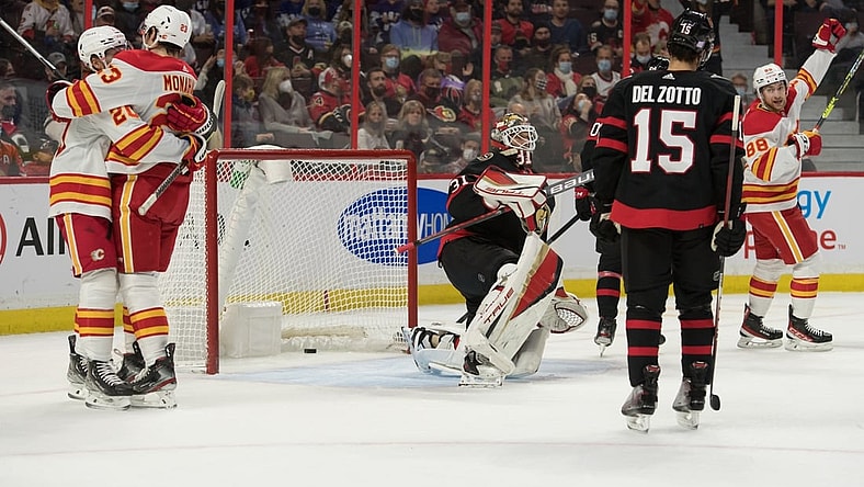 Nov 14, 2021; Ottawa, Ontario, CAN; The Calgary Flames celebrate a goal scored by left wing Andrew Mangiapane (88) against Ottawa Senators goalie Anton Forsberg (31) in the first period at the Canadian Tire Centre. Mandatory Credit: Marc DesRosiers-USA TODAY Sports