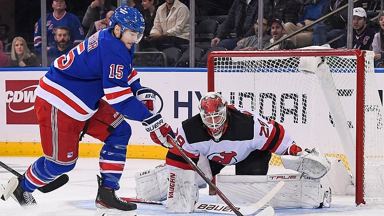 Nov 14, 2021; New York, New York, USA;  New York Rangers right wing Julien Gauthier (15) attempts a hots on New Jersey Devils goaltender Mackenzie Blackwood (29) during the first period at Madison Square Garden. Mandatory Credit: Dennis Schneidler-USA TODAY Sports