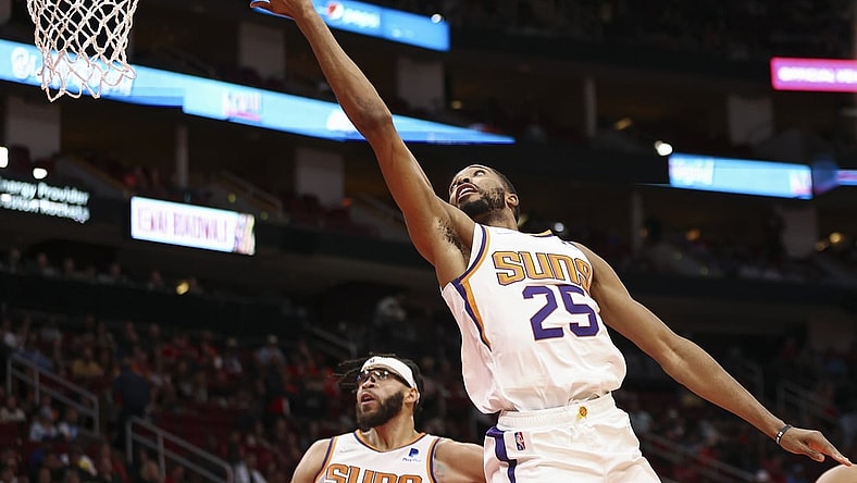 Nov 14, 2021; Houston, Texas, USA; Phoenix Suns forward Mikal Bridges (25) shoots the ball during the second quarter against the Houston Rockets at Toyota Center. Mandatory Credit: Troy Taormina-USA TODAY Sports