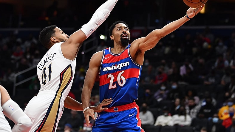 Nov 15, 2021; Washington, District of Columbia, USA; Washington Wizards guard Spencer Dinwiddie (26) shoots as New Orleans Pelicans forward Garrett Temple (41) defends during the first half at Capital One Arena. Mandatory Credit: Brad Mills-USA TODAY Sports
