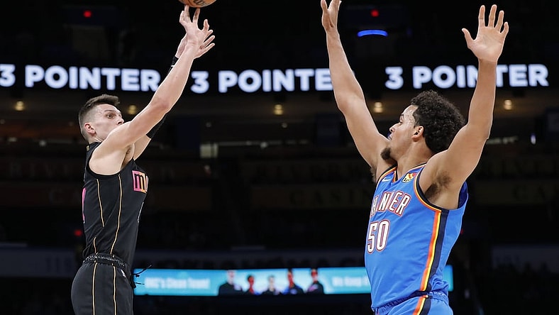 Nov 15, 2021; Oklahoma City, Oklahoma, USA; Miami Heat guard Tyler Herro (14) shoots as Oklahoma City Thunder forward Jeremiah Robinson-Earl (50) defends during the first quarter at Paycom Center. Mandatory Credit: Alonzo Adams-USA TODAY Sports