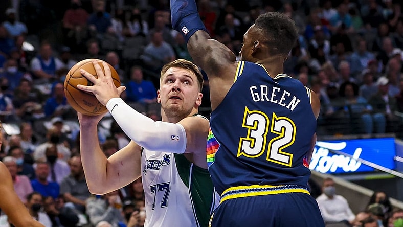 Nov 15, 2021; Dallas, Texas, USA;  Dallas Mavericks guard Luka Doncic (77) looks to shoot as Denver Nuggets forward Jeff Green (32) defends during the first quarter at American Airlines Center. Mandatory Credit: Kevin Jairaj-USA TODAY Sports