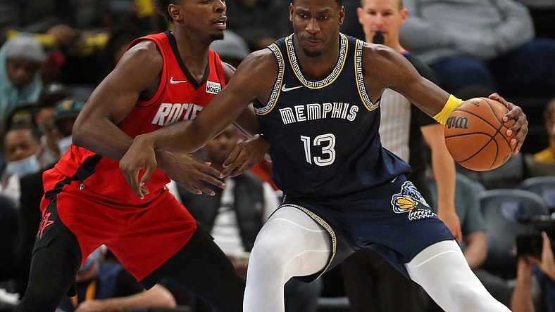 Nov 15, 2021; Memphis, Tennessee, USA; Memphis Grizzles forward Jaren Jackson Jr. (13) drives to the basket as Houston Rockets forward Jae'Sean Tate (8) defends during the first half at FedExForum. Mandatory Credit: Petre Thomas-USA TODAY Sports