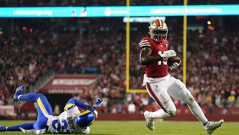 Nov 15, 2021; Santa Clara, California, USA; San Francisco 49ers wide receiver Deebo Samuel (19) runs for a touchdown past Los Angeles Rams cornerback Robert Rochell (31) in the second quarter at Levi's Stadium. Mandatory Credit: Cary Edmondson-USA TODAY Sports