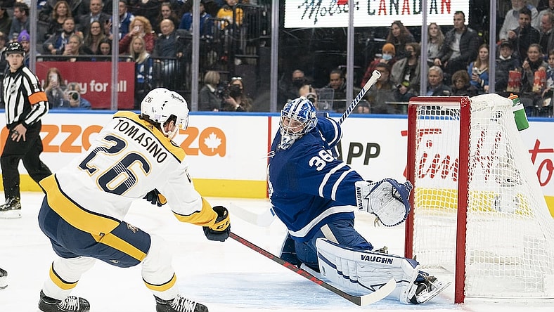Nov 16, 2021; Toronto, Ontario, CAN;  Nashville Predators center Philip Tomasino (26) charges the net on Toronto Maple Leafs goaltender Jack Campbell (36) during the first period  at Scotiabank Arena. Mandatory Credit: Nick Turchiaro-USA TODAY Sports