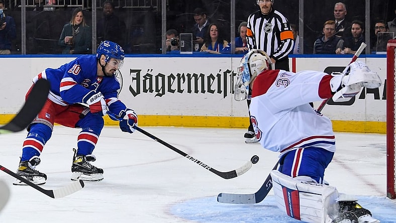 Nov 16, 2021; New York, New York, USA; New York Rangers left wing Chris Kreider (20) shots the puck and scores against Montreal Canadiens goaltender Cayden Primeau (30) during the second period at Madison Square Garden. Mandatory Credit: Dennis Schneidler-USA TODAY Sports